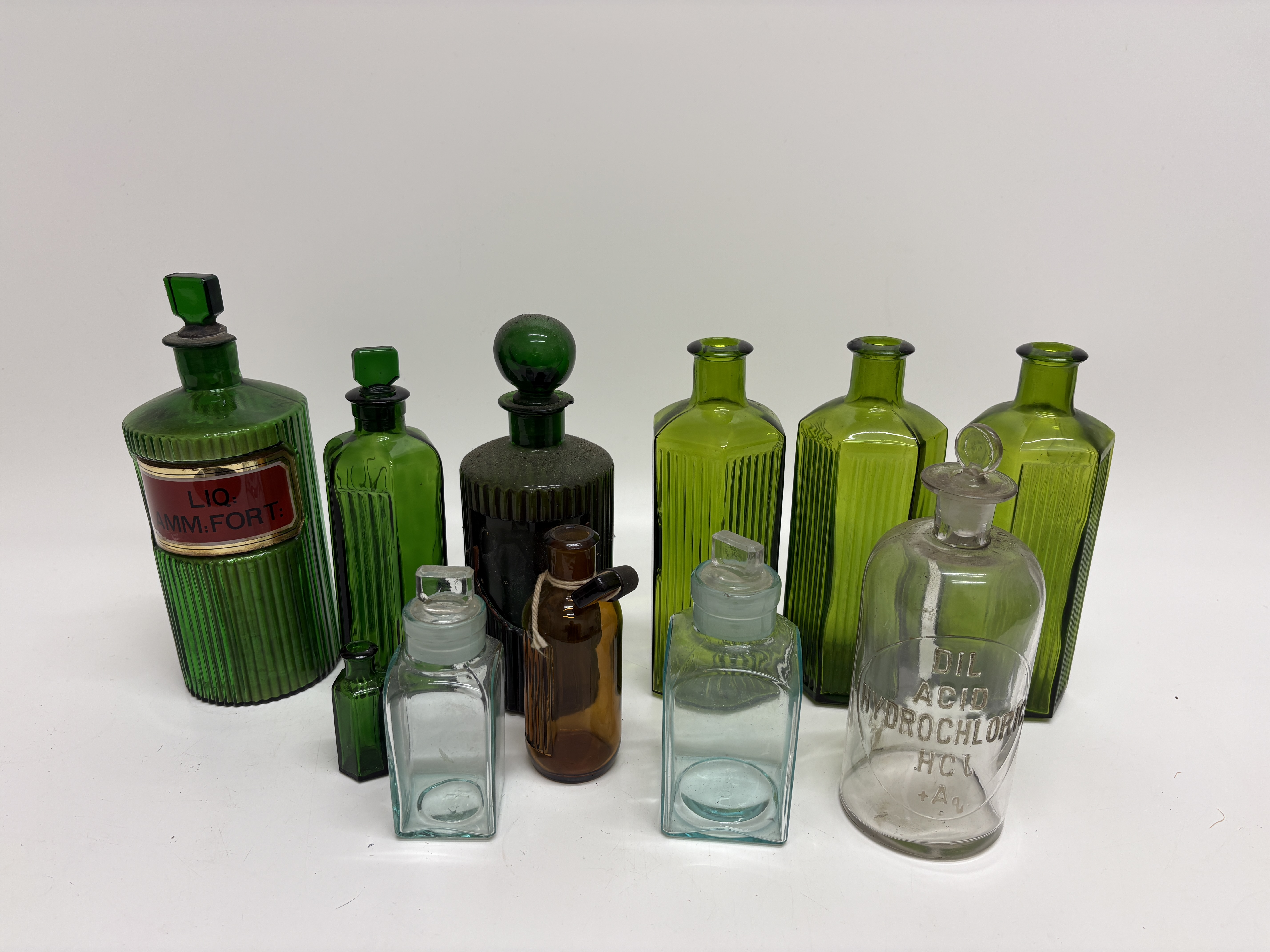 A Collection of Victorian Glass Apothecary and Chemist Bottles