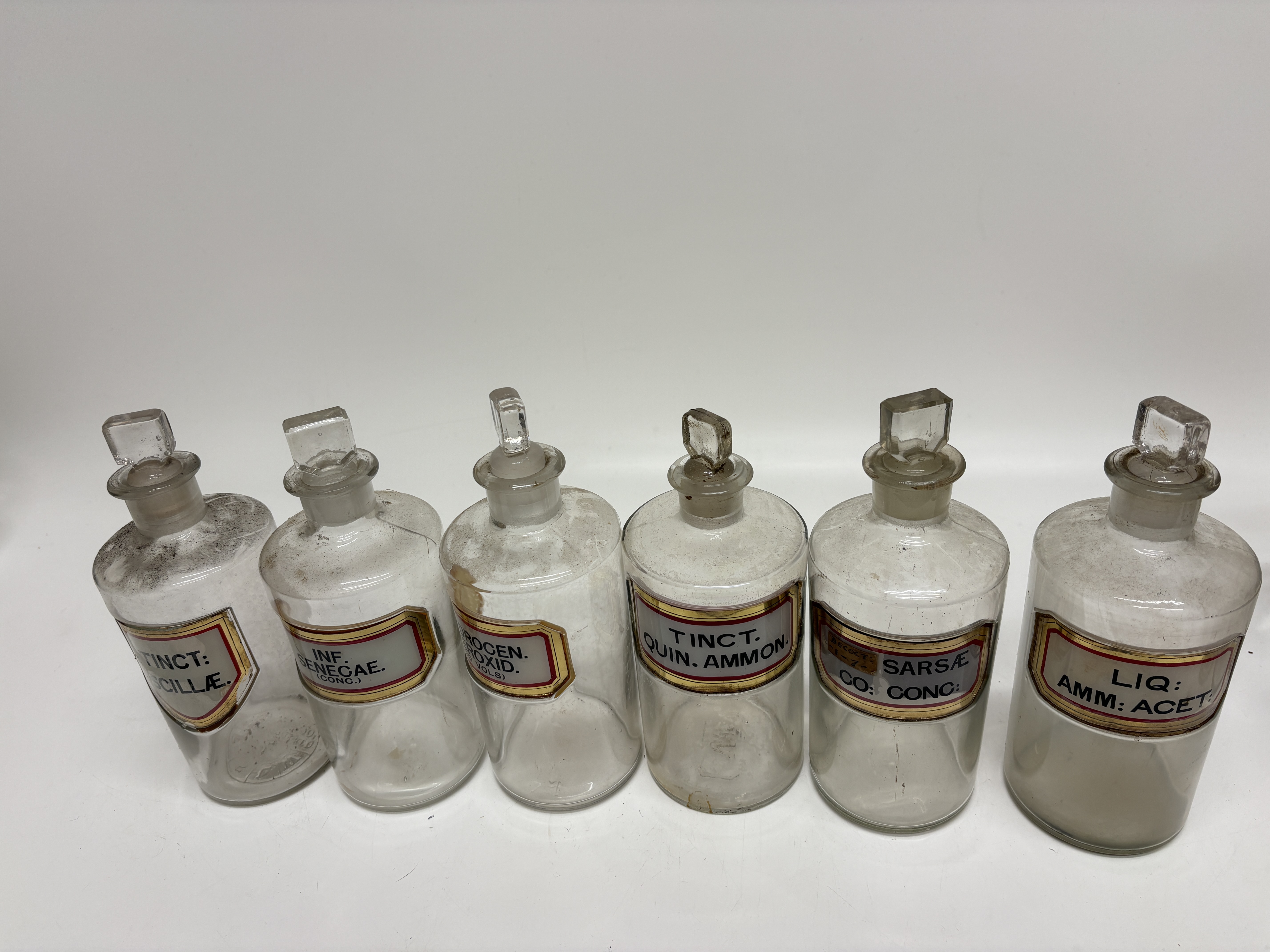A set of six early 20th-century glass apothecary shop rounds 22cm
