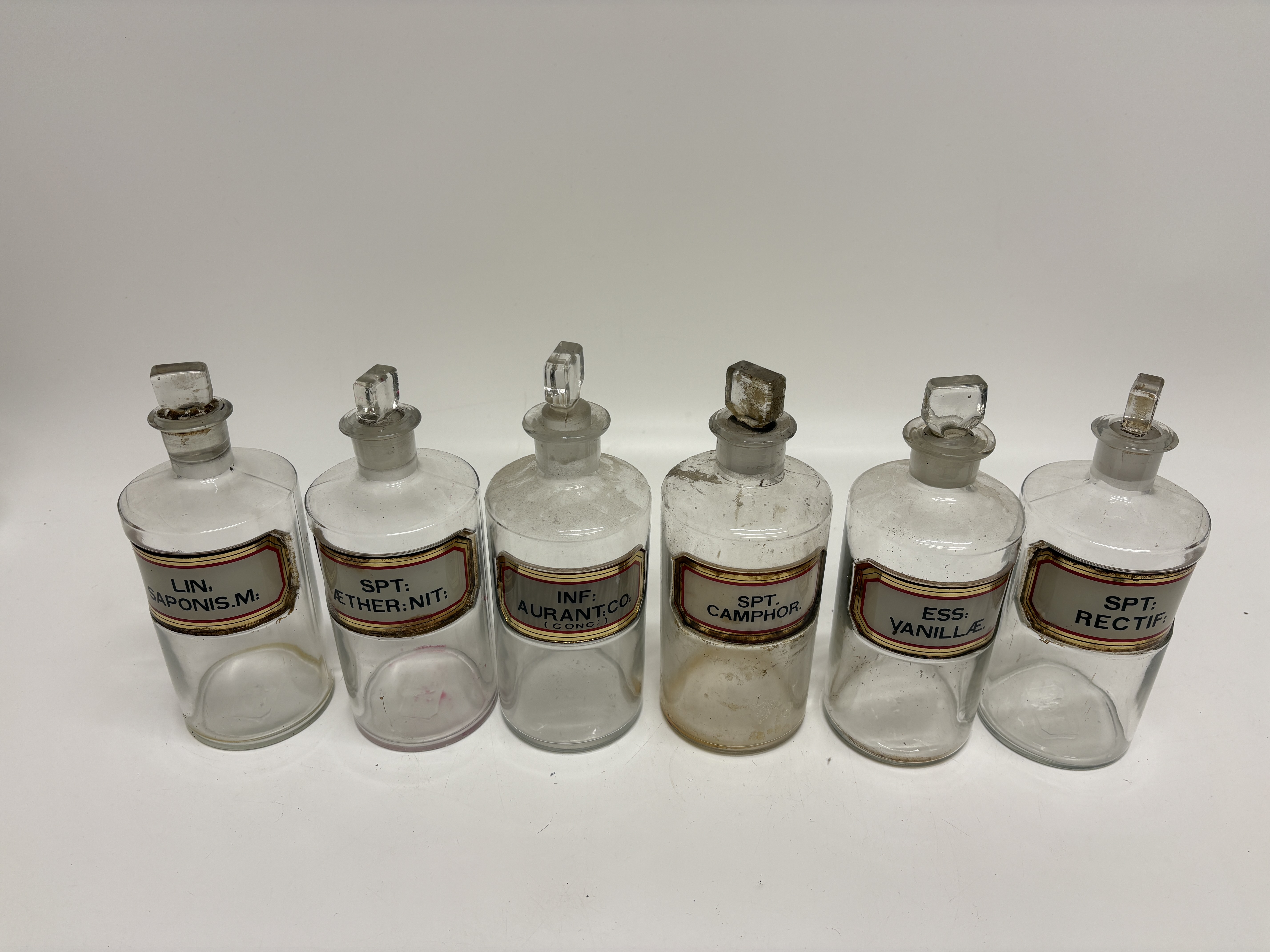 A Set of Six Victorian Clear Glass Apothecary Bottles 22cm