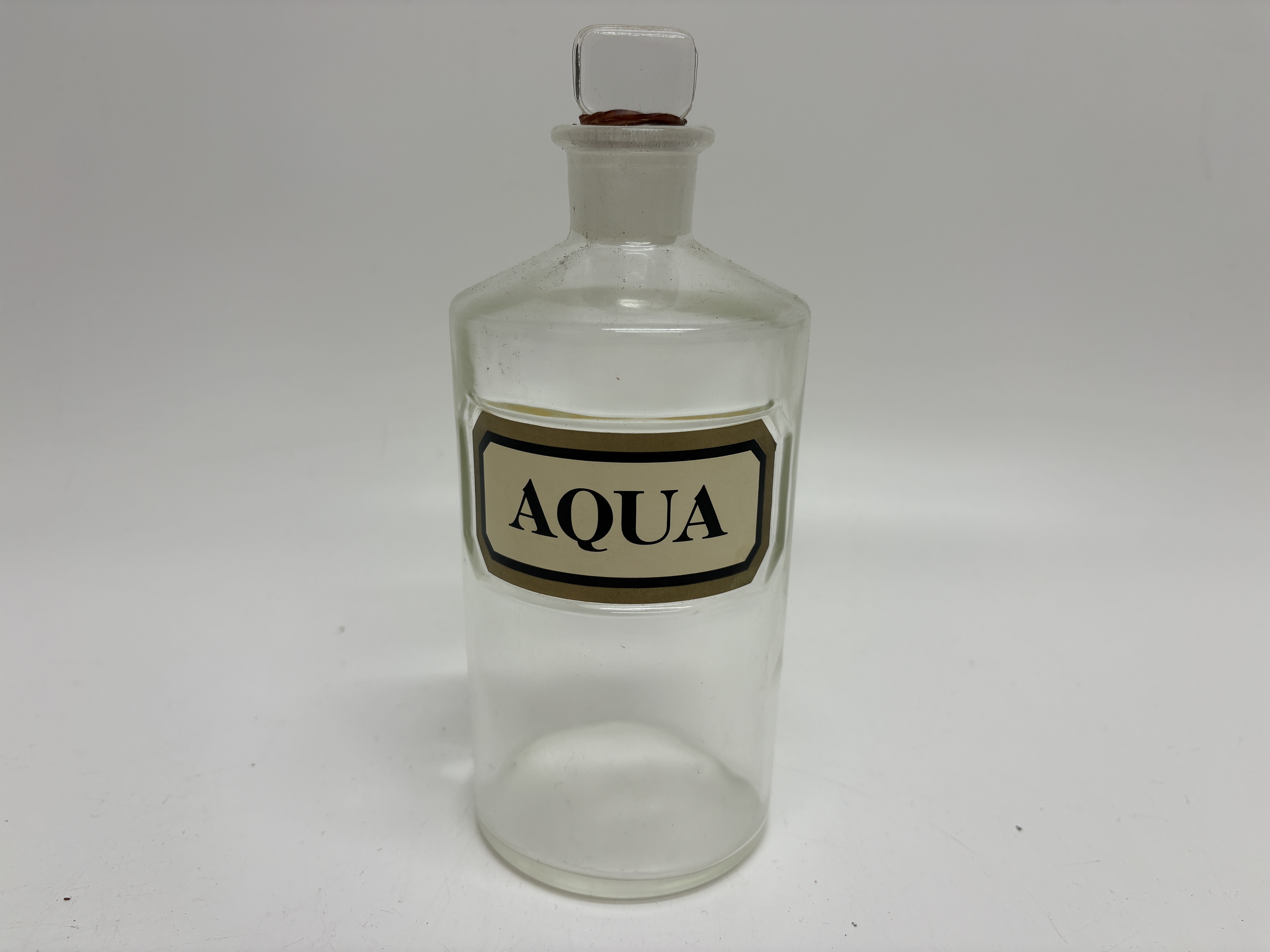 Antique Clear Glass Apothecary Bottle with Ground Glass Stopper and Aqua Label