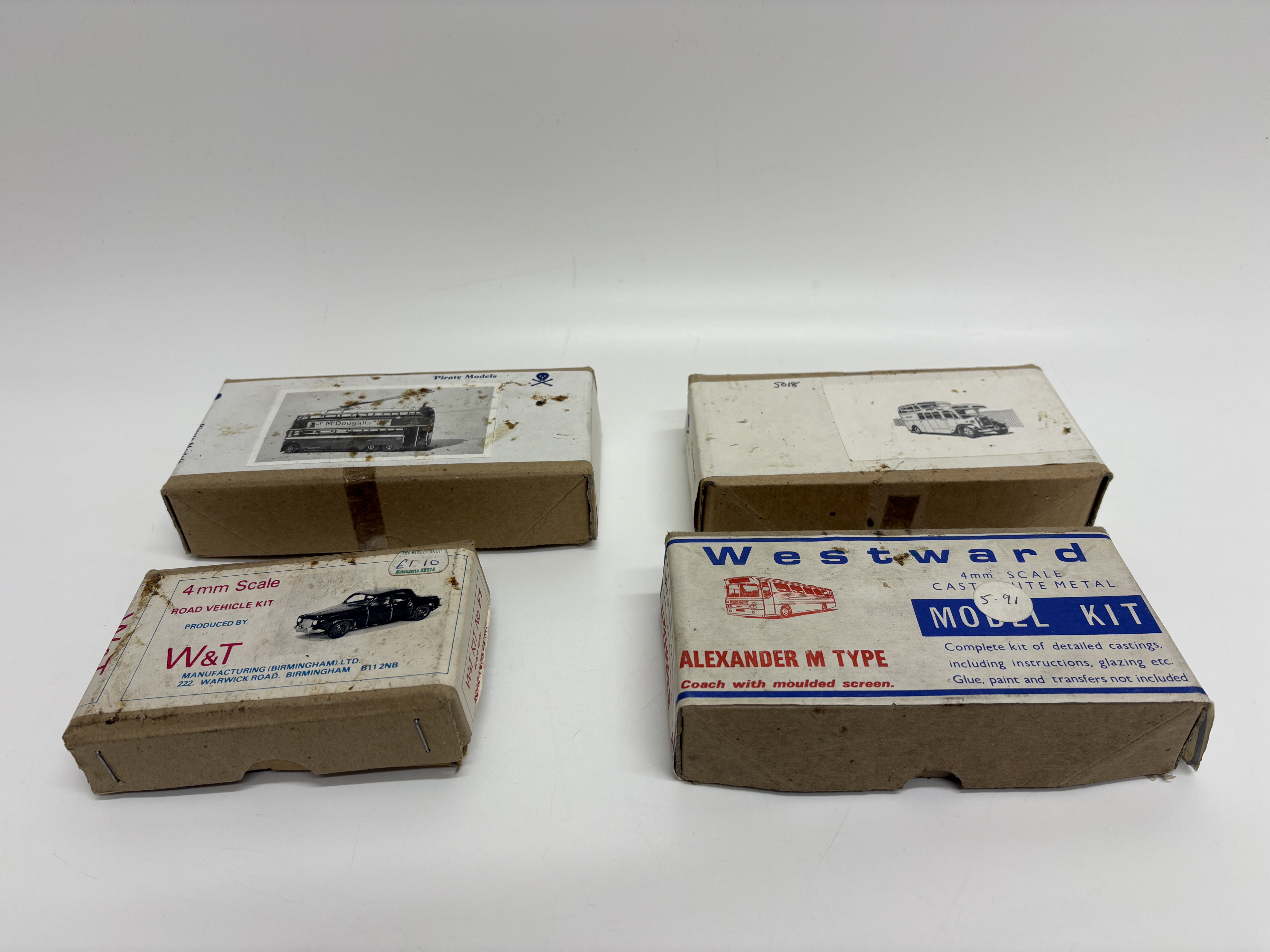 A Collection of Four 4mm Scale White Metal Model Vehicle Kits by Pirate Models Westward and W&T Manufacturing