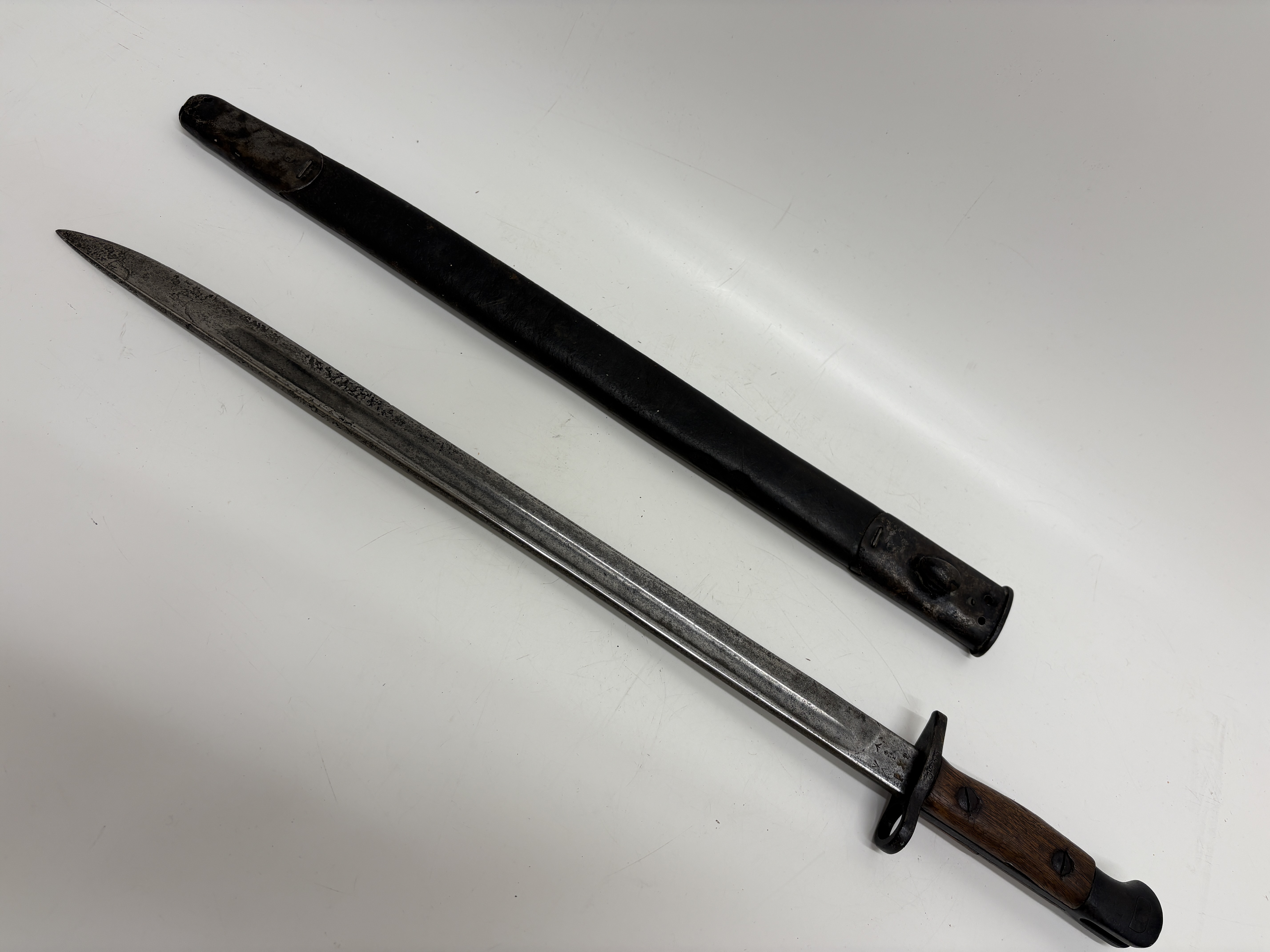 A British Pattern 1907 sword bayonet and scabbard by Enfield dated 1908
