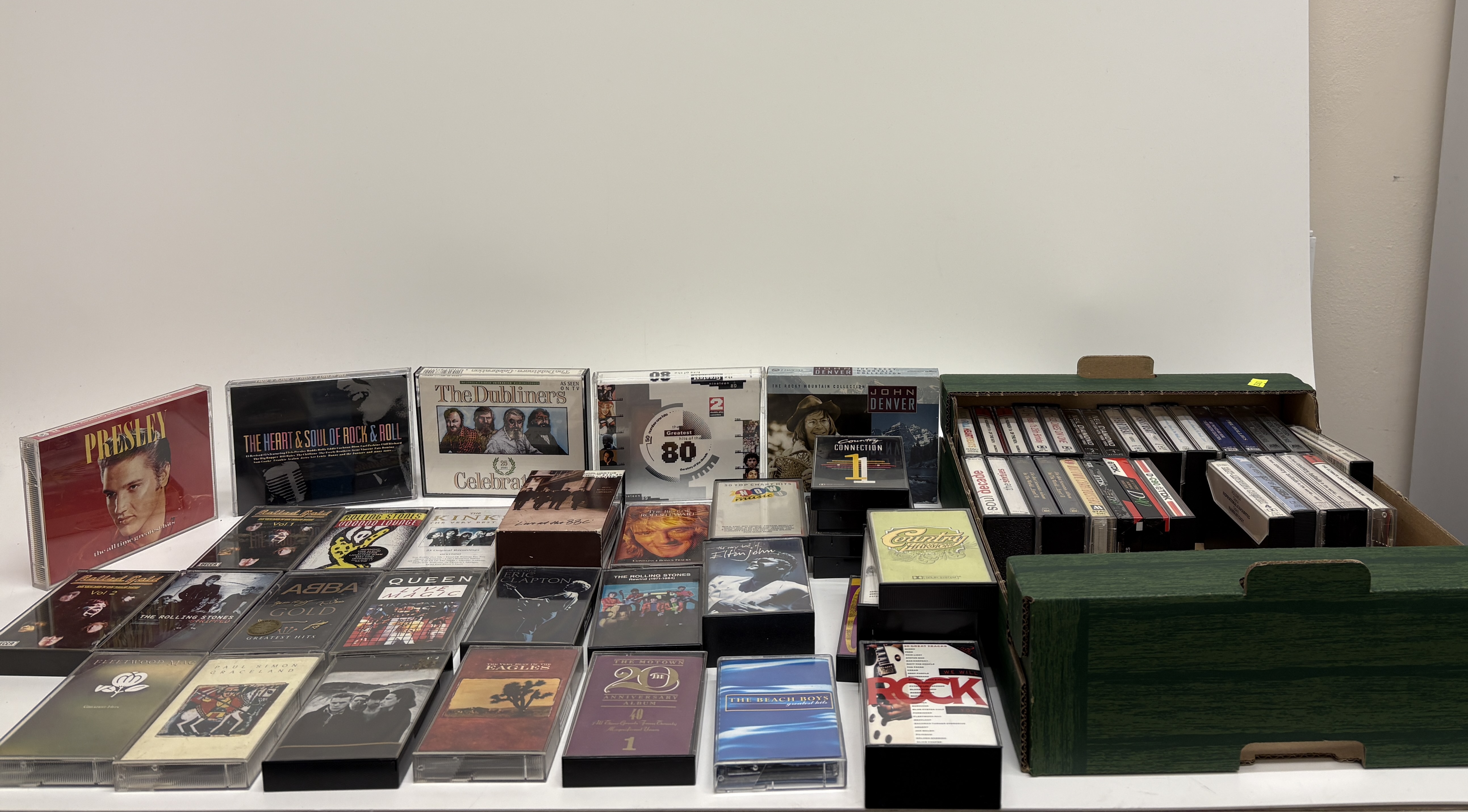 An Assortment of Music Cassette Tapes and Compact Disc Sets