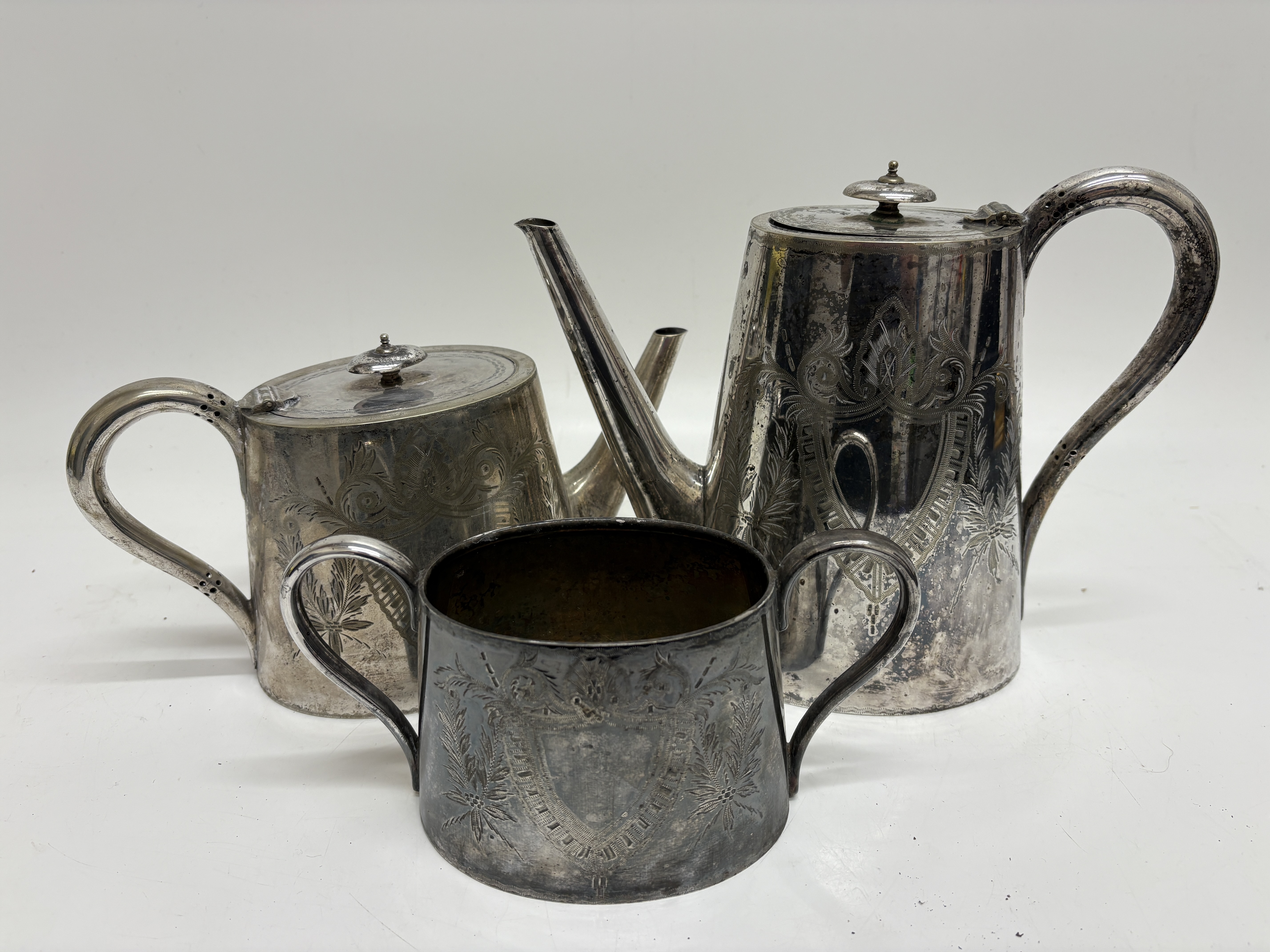 A three-piece Victorian Deykin and Sons silver-plated tea and coffee service