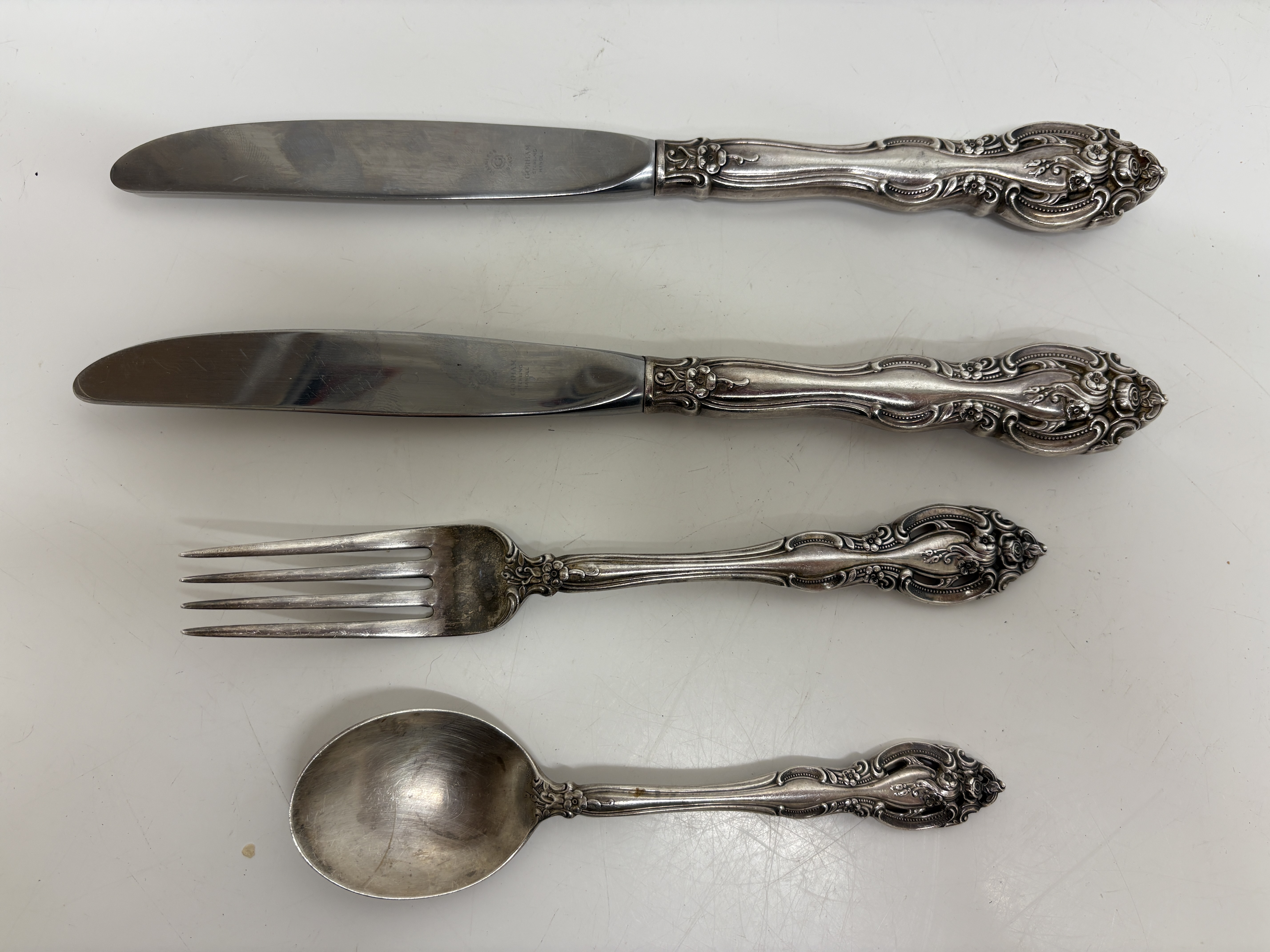 A Group of Hallmarked Gorham Sterling Silver Flatware in the Buttercup Pattern - Fork/Spoon circa 112.9 grams Knives Gross 179g stainless steel blade filled handles