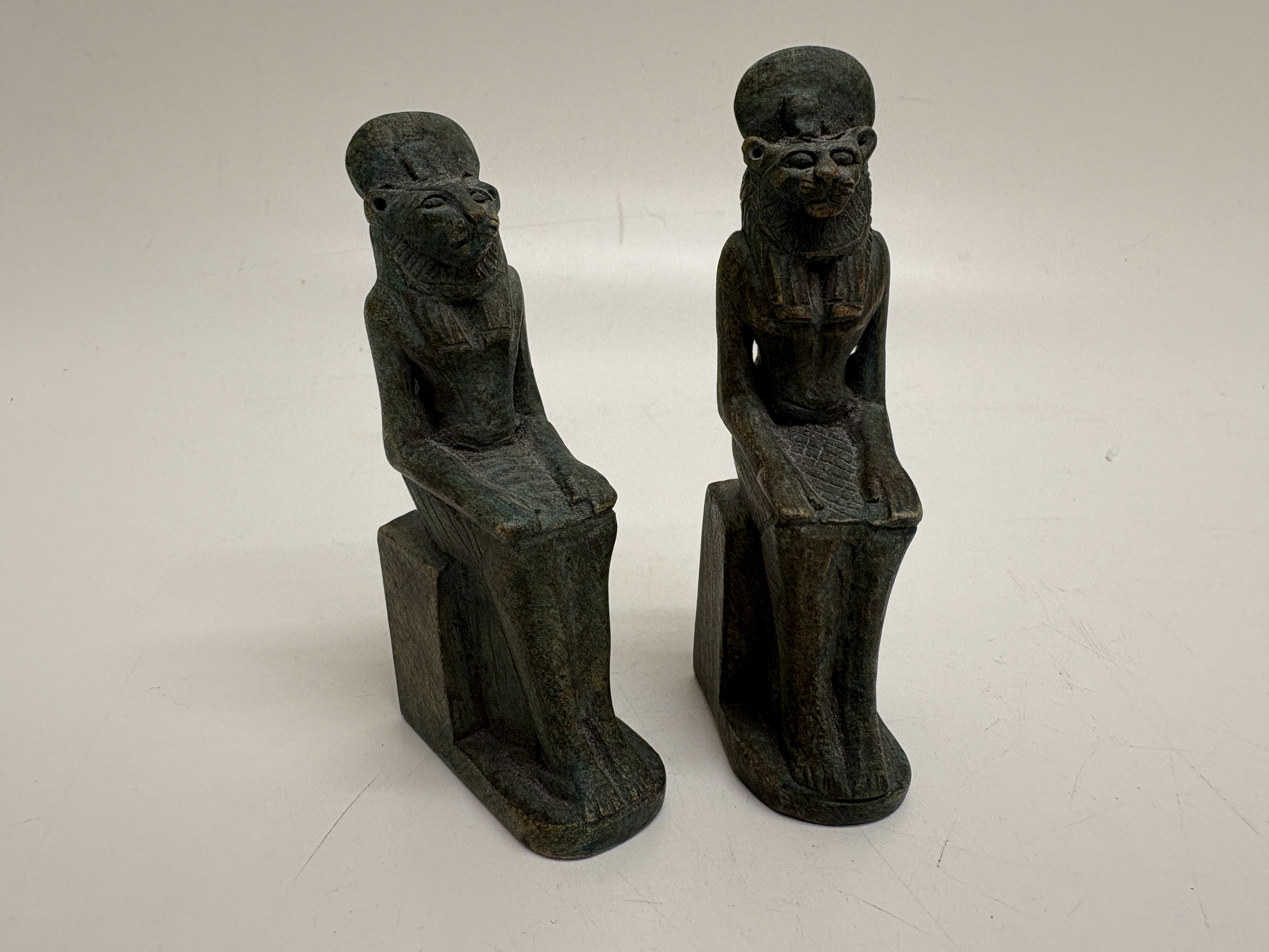 A pair of Egyptian Revival style seated Sekhmet figurines