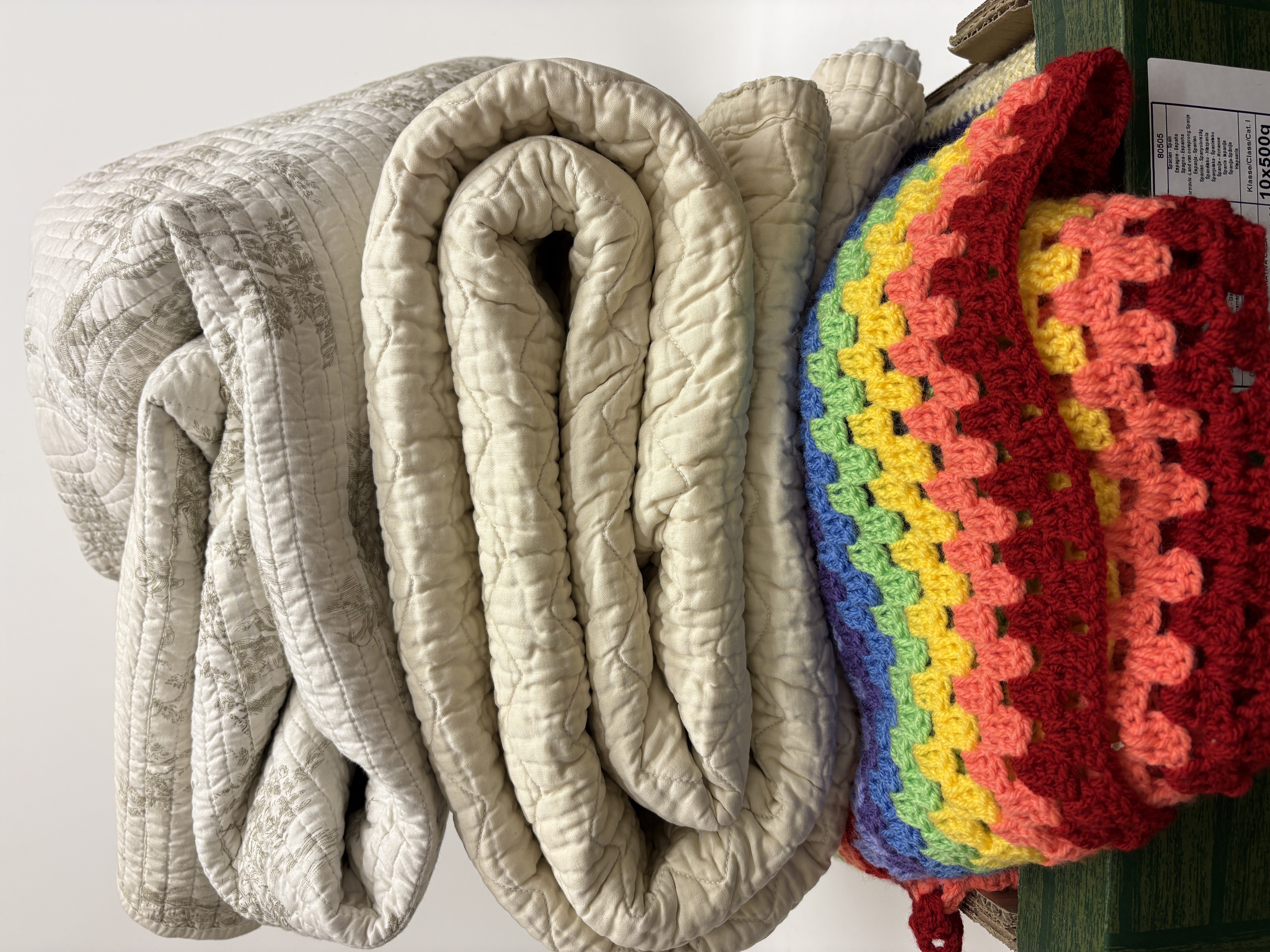 An Assortment of Six Domestic Textiles Including Quilted Bedspreads and Crochet Blankets