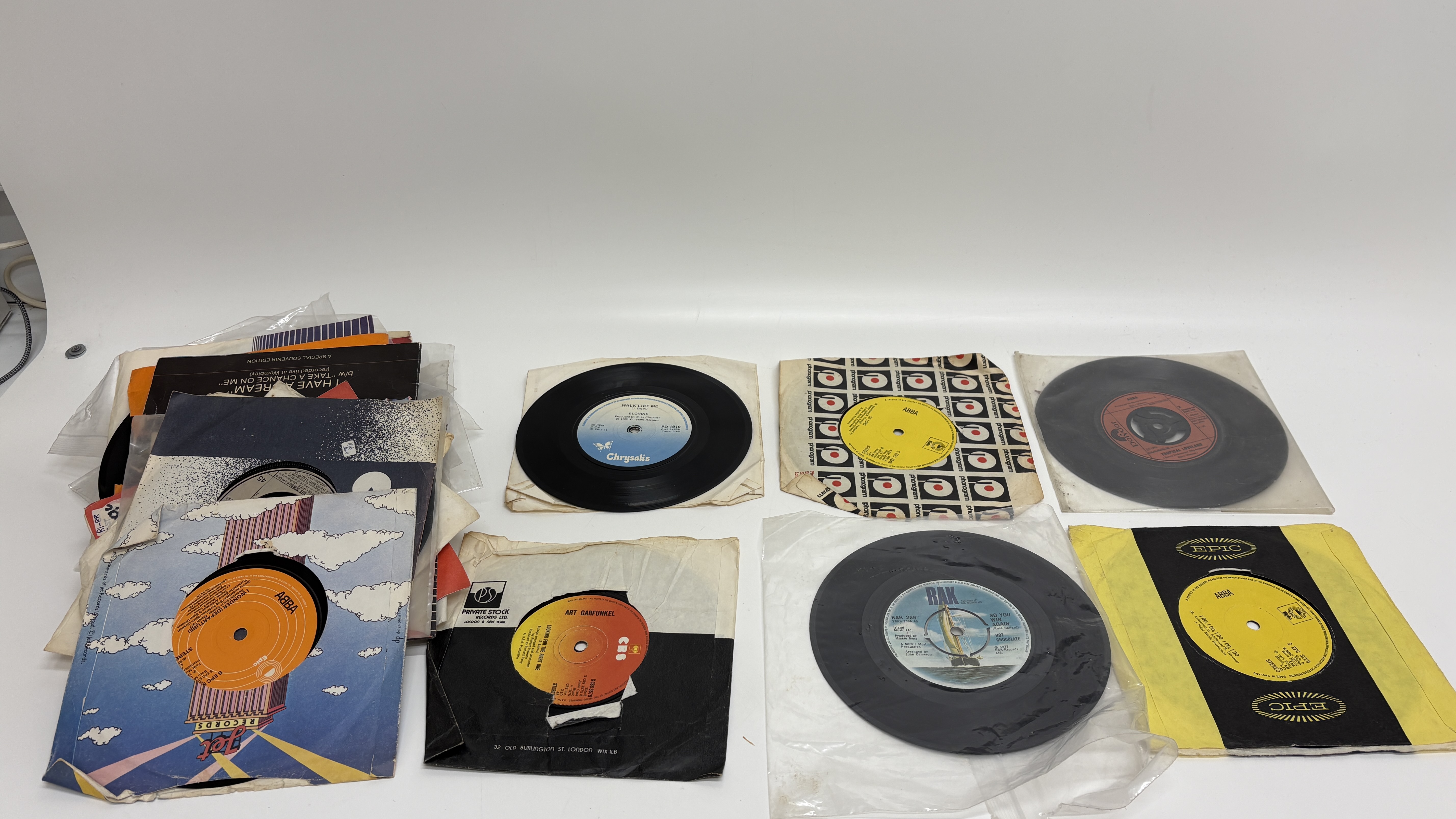 A Collection of Approximately 40 7" Vinyl Records including Elvis Presley EPs and Singles 1960s-1980s