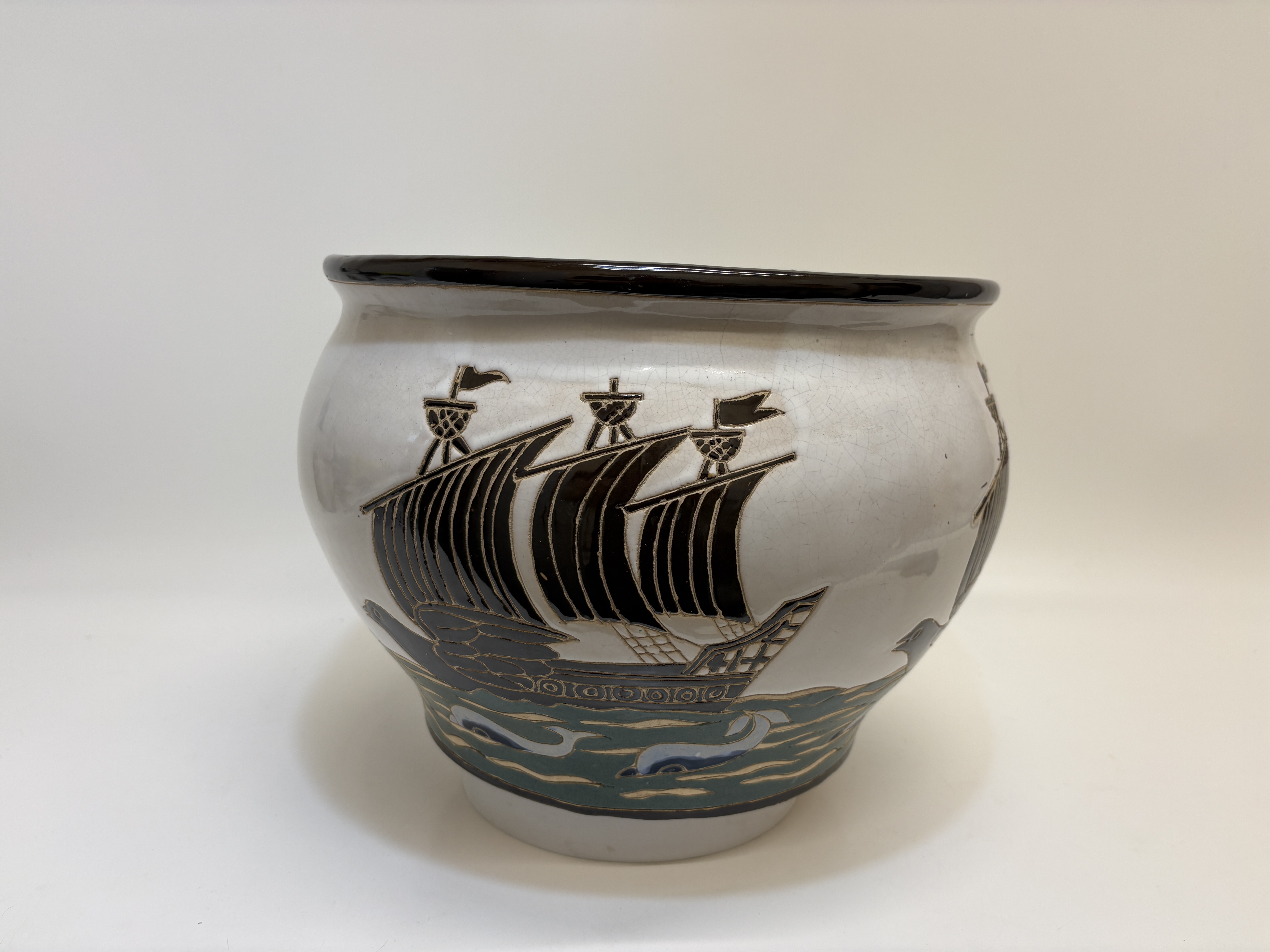 A C.H. Brannam Barum Ware sgraffito decorated nautical earthenware jar 36cm wide