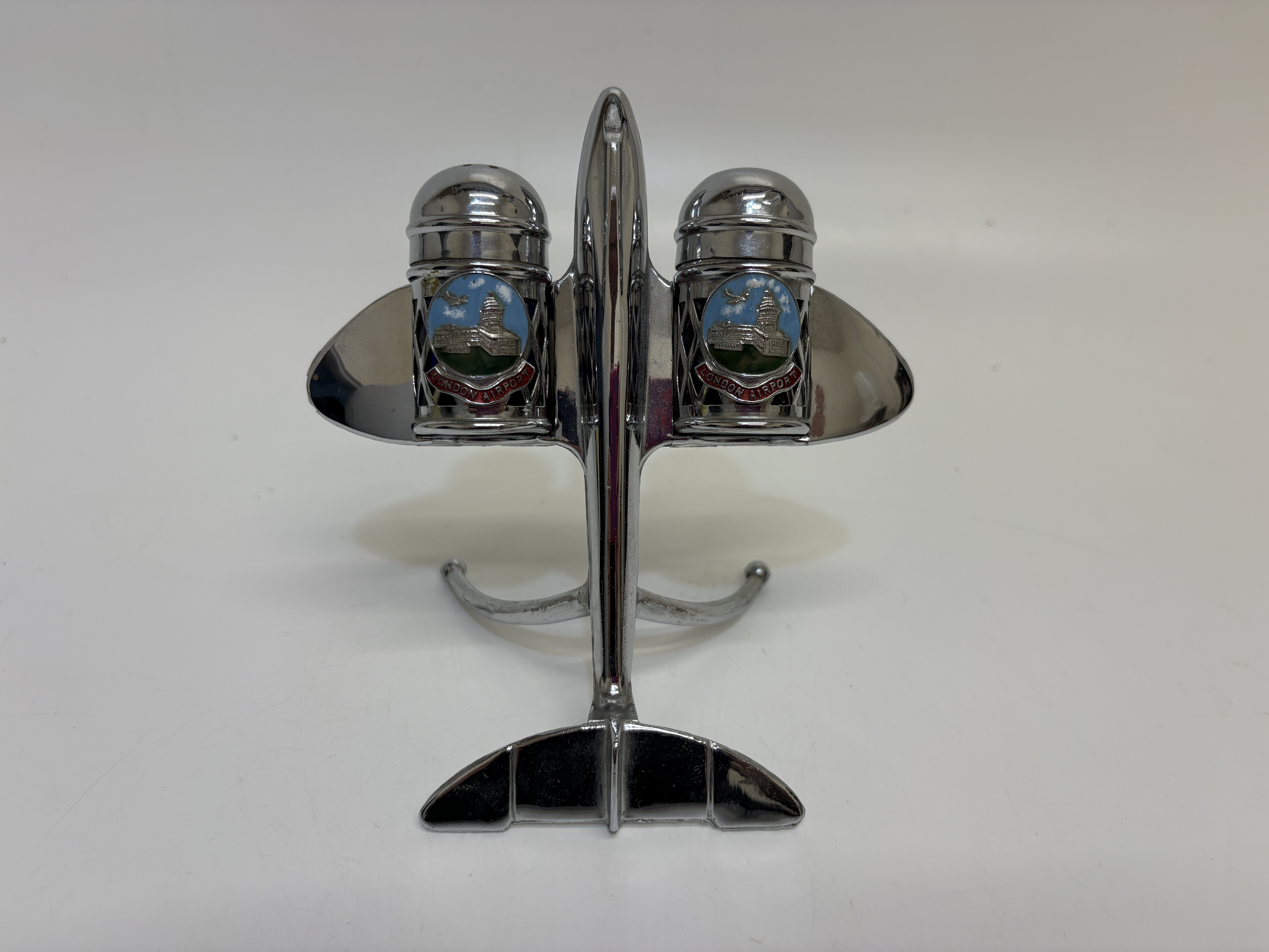 A mid-20th-century chrome-plated jet aircraft souvenir London Airport salt and pepper cruet set