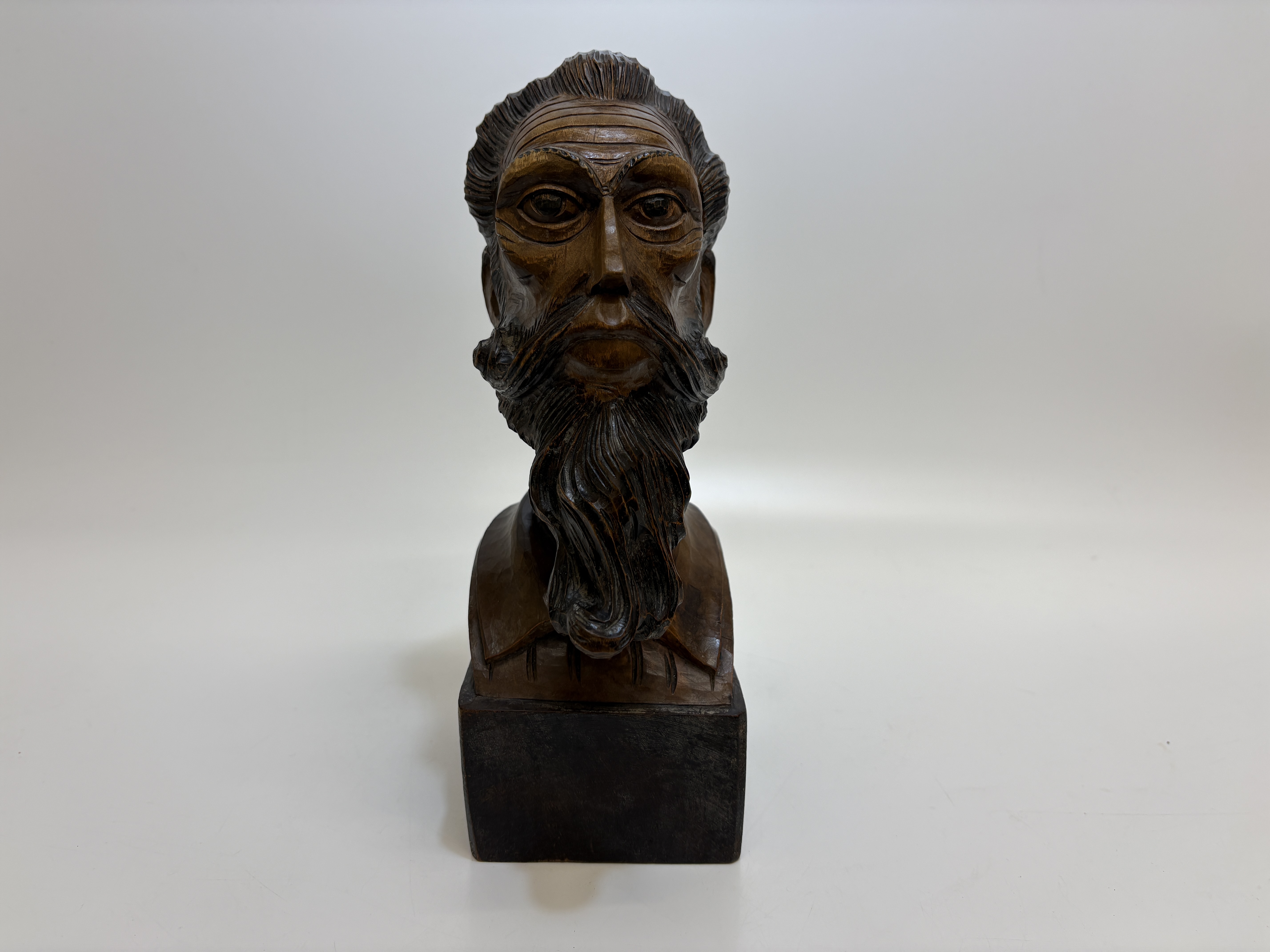A carved hardwood bust of Don Quixote 26cm tall