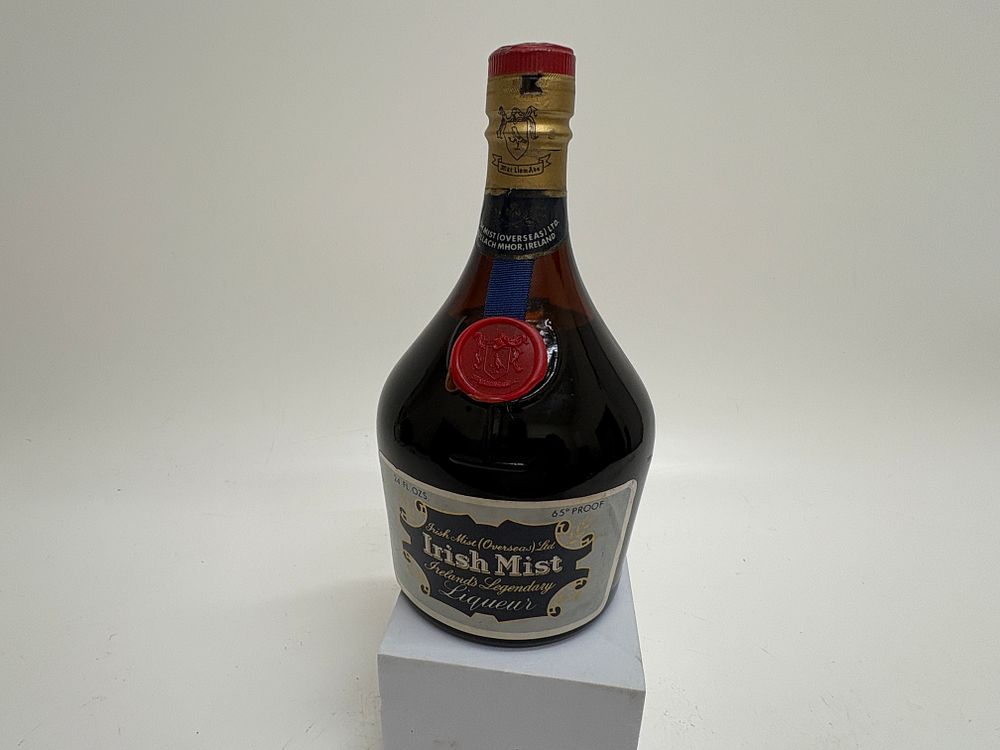 Lot 462: Two vintage spirit bottles comprising a Bell's blended Scotch whisky decanter and an Irish Mist liqueur bottle