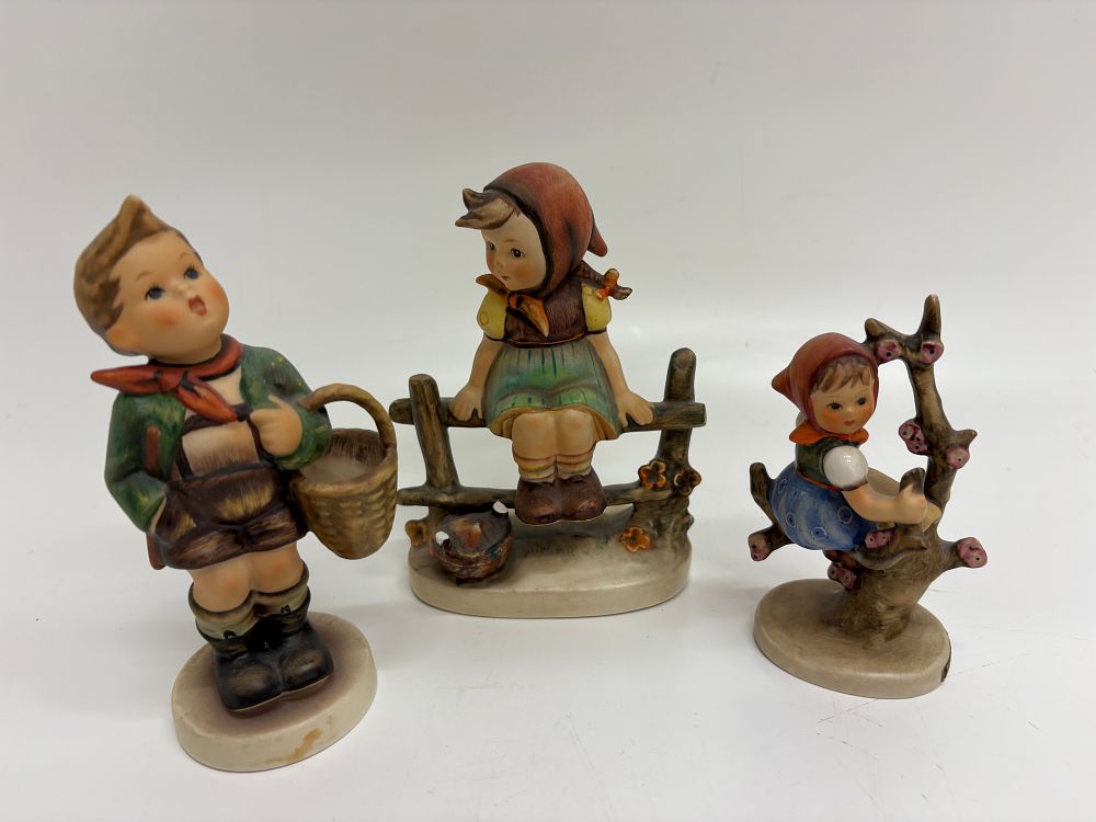 Lot 556: A Trio of West German Goebel Hummel Glazed Ceramic Figurines