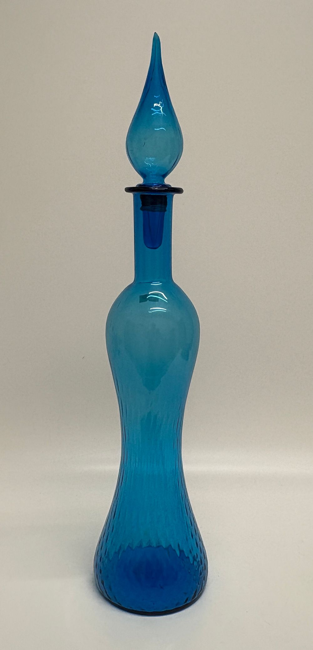 Lot 645: An Italian blue glass decanter with a matching flame stopper