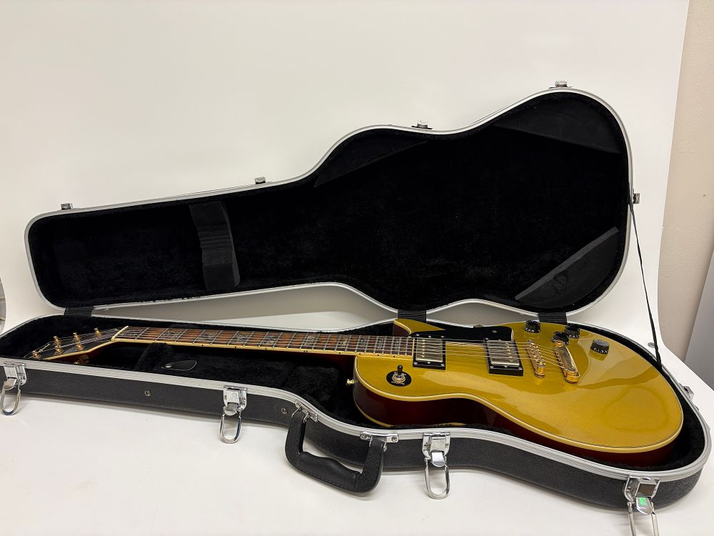 Lot 653: A Westfield single-cutaway electric guitar with goldtop finish and a Gibson hardshell case