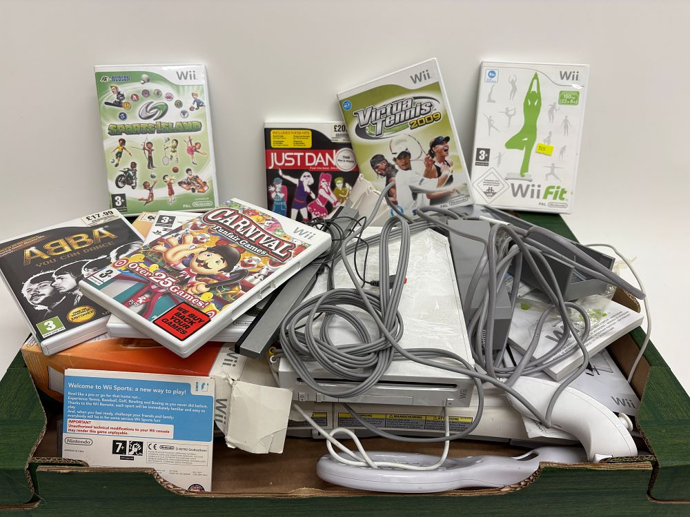 Lot 674: Nintendo Wii RVL-001 Home Video Game Console Bundle with Balance Board and Games