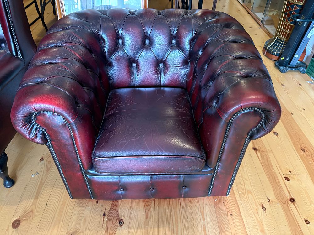 Lot 685: A Chesterfield style oxblood leather club armchair