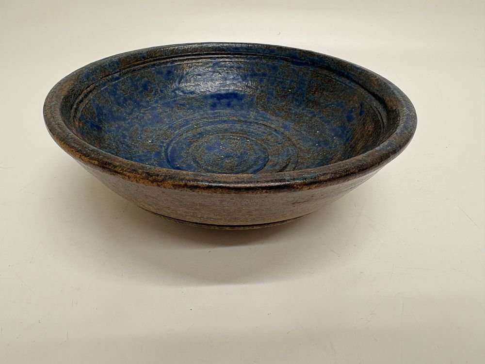 Lot 702: A studio pottery stoneware bowl with a stepped base and cobalt blue glaze