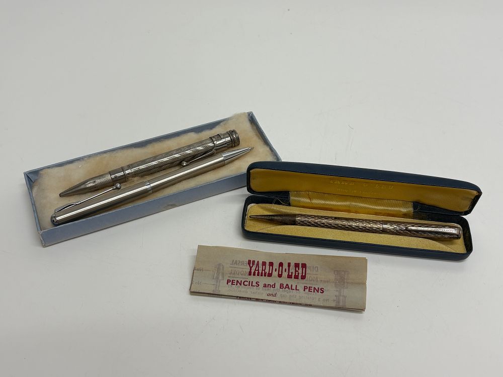 Lot 89: A Trio of Vintage British Writing Instruments One hallmarked silver Yard-O-Led Propelling Pencil and Case