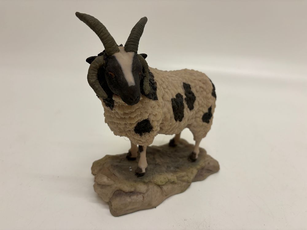 Lot 709: An Arista Designs Ltd hand painted resin Jacob ram figurine by P Moss dated 1982