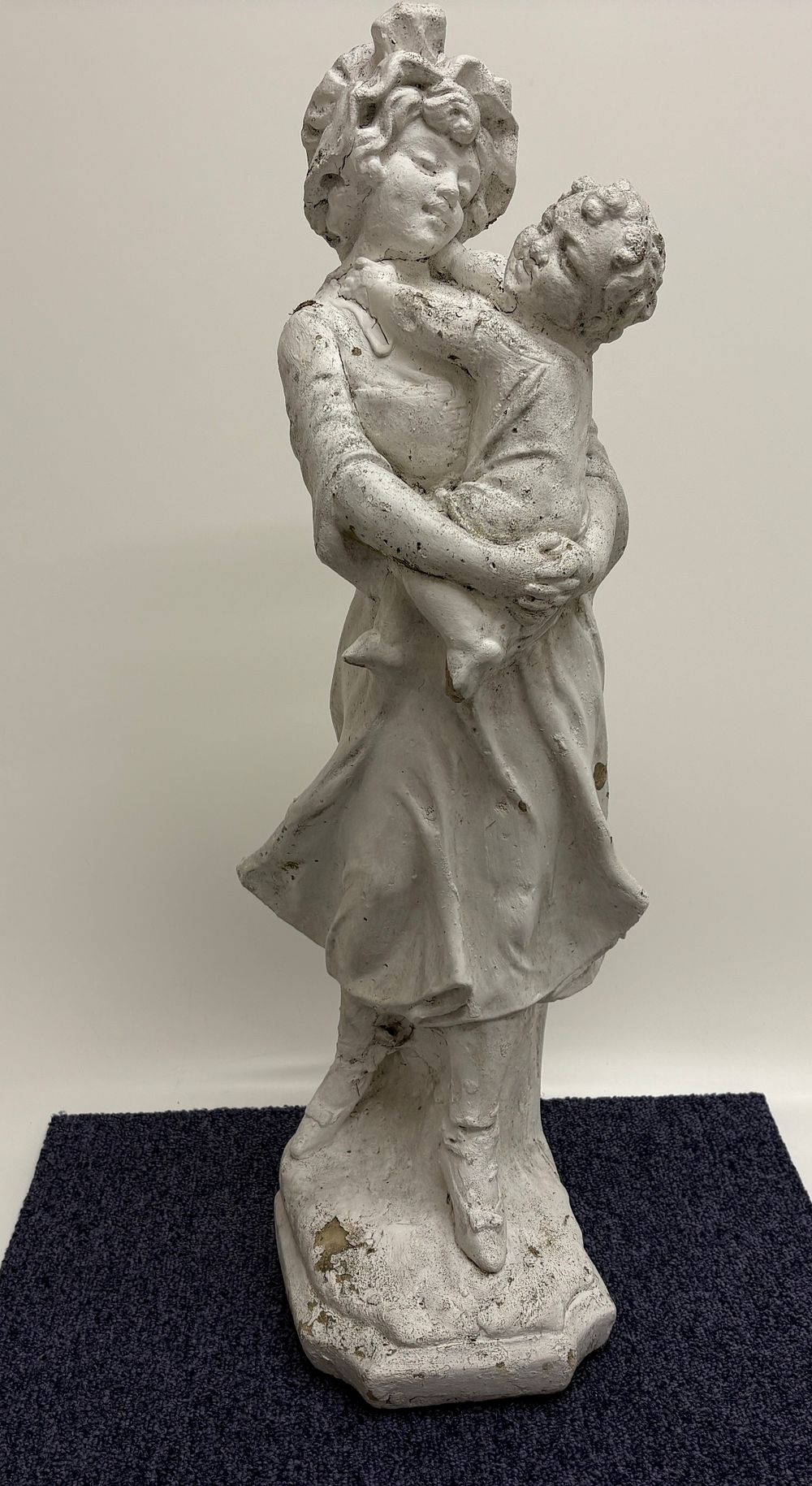 Lot 714: A weathered cast stone garden statue of a woman and child height 68cm