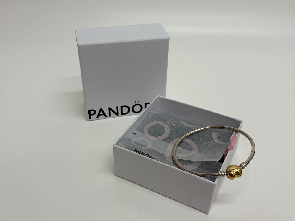 Lot 719: A Pandora two-tone heart clasp bangle bracelet with original box