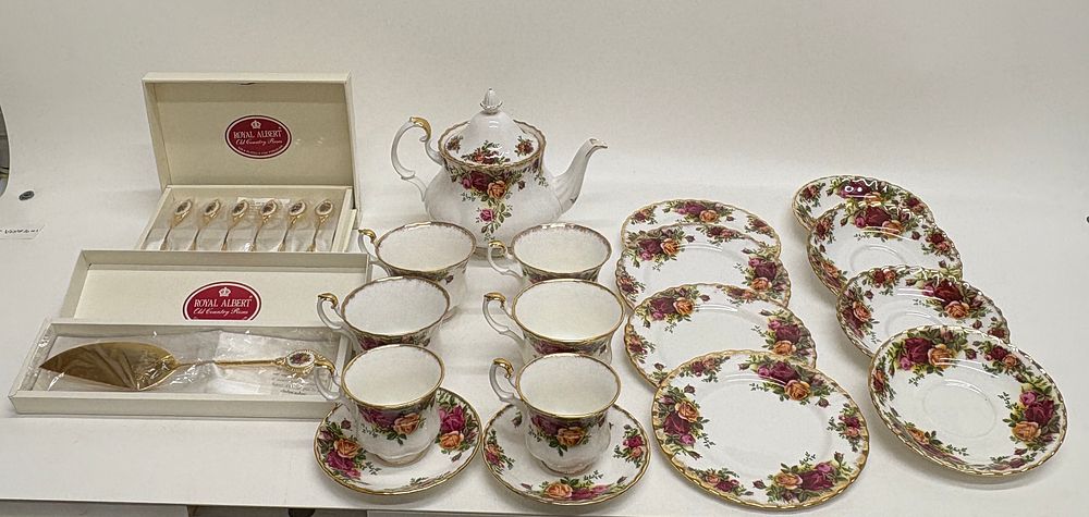 Lot 735: A Royal Albert Old Country Roses pattern bone china tea service including boxed gold-plated cutlery