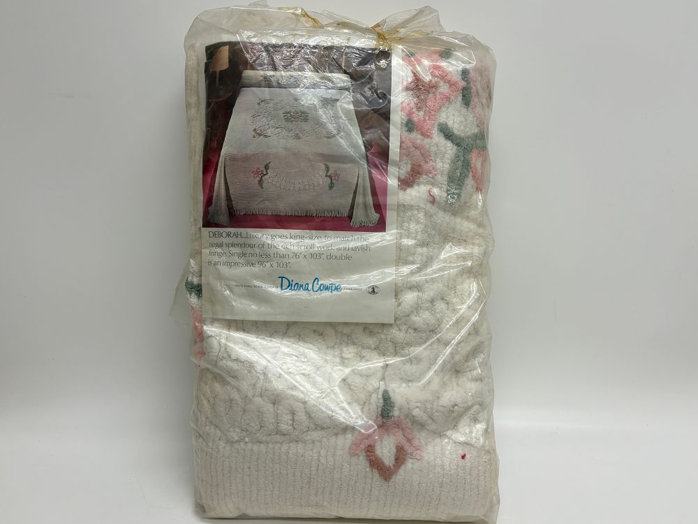 Lot 740: A Diana Cowpe Deborah pattern tufted candlewick bedspread in original retail packaging