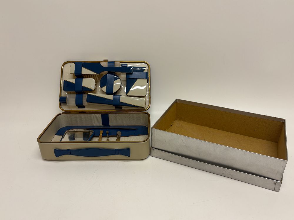 Lot 743: A Mid-20th Century Art Deco Style Travel Grooming and Vanity Set