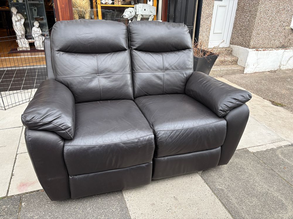 Lot 762: A contemporary dark brown leather two seater sofa