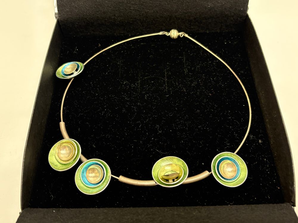 Lot 720: A contemporary sterling silver and enamel collar necklace by The Necessary Angel