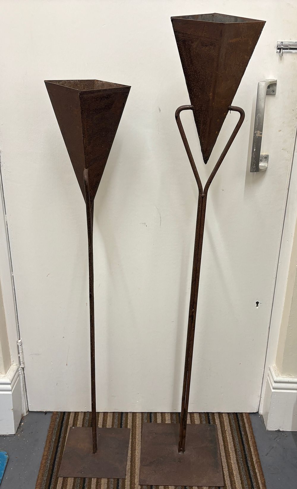 Lot 679: A Pair of Brutalist Welded Steel Floor Standing Flambeaux
