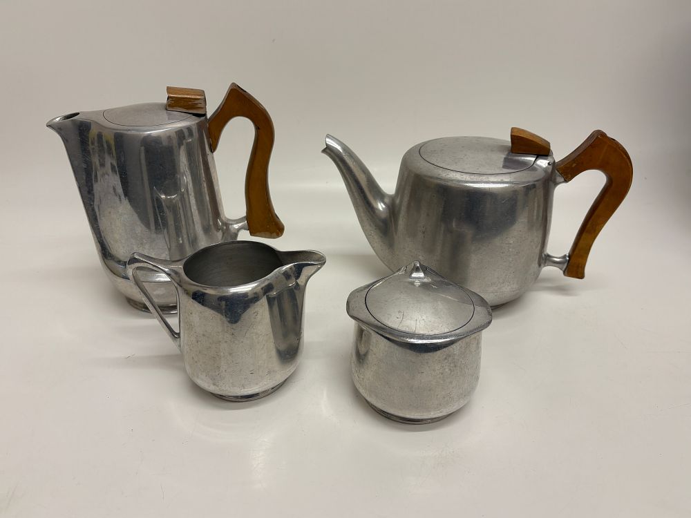 Lot 661: A Picquot Ware four-piece tea and coffee service