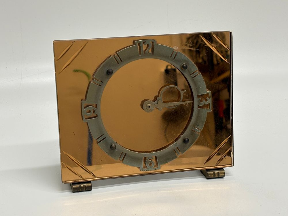Lot 657: Art Deco Peach Mirrored Glass Mantel Clock