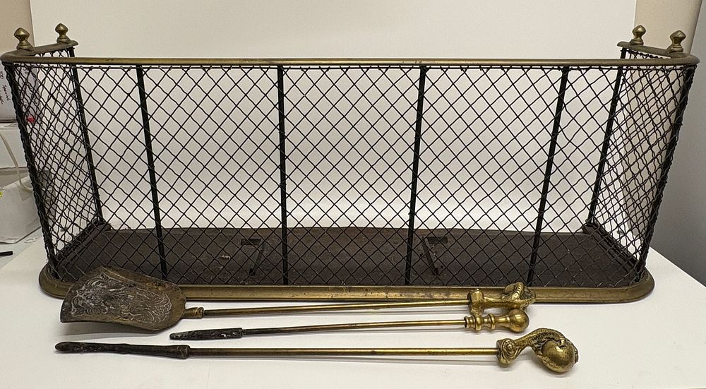 Lot 639: A Victorian brass and wire mesh nursery fender and a trio of fire tools