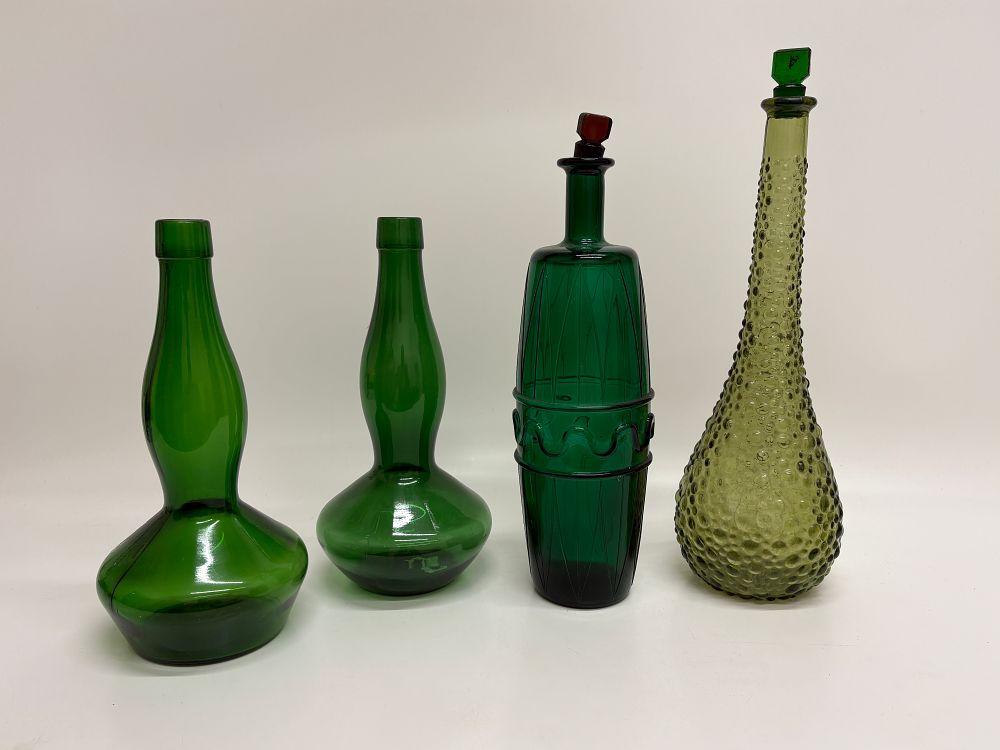 Lot 636: An Assortment of Decorative Green Glass Decanters and Bottles