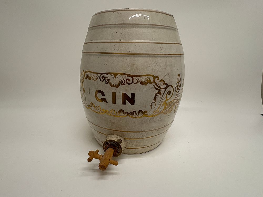 Lot 609: A ceramic gin spirit barrel with wooden spigot