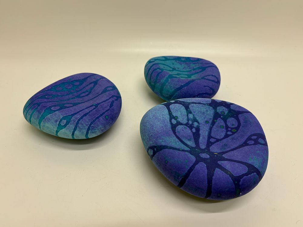 Lot 551: A trio of contemporary studio ceramic pebble sculptures - circa 15x15cm