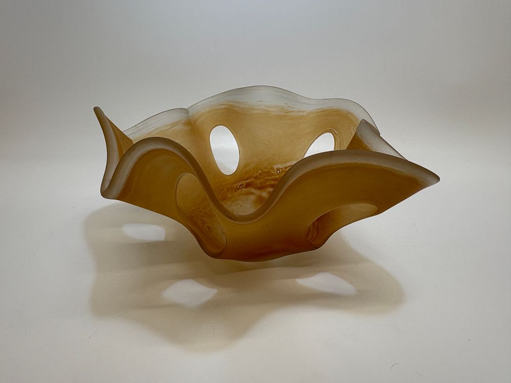 Lot 387: A mid-century modern amber and frosted art glass bowl with teardrop piercings 16x35cm