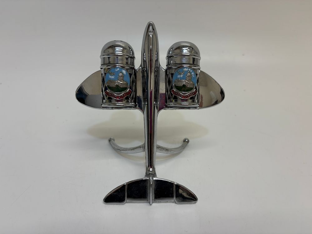 Lot 377: A mid-20th-century chrome-plated jet aircraft souvenir London Airport salt and pepper cruet set