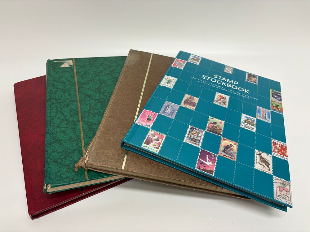 Lot 364: A Collection of Four Worldwide Stamp Stockbooks, Including UK, Eire, and US Issues