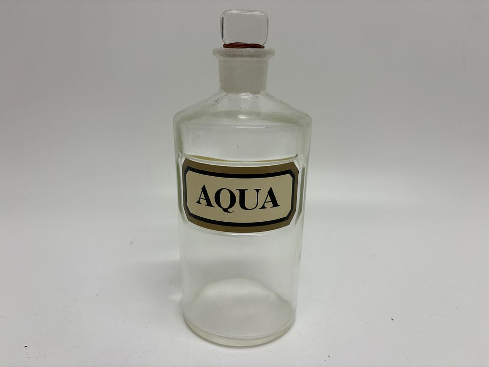 Lot 308: Antique Clear Glass Apothecary Bottle with Ground Glass Stopper and Aqua Label