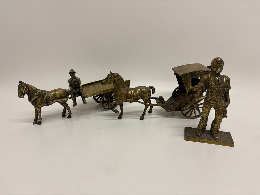 Lot 288: A Collection of Cast Brass Miniature Figures and Transport Models
