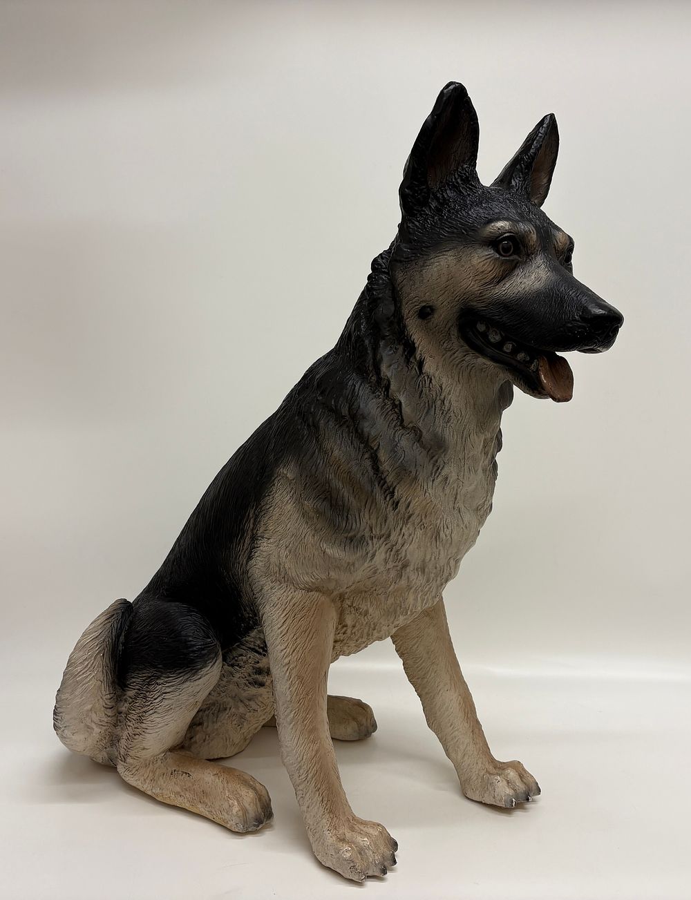 Lot 151: A large seated German Shepherd decorative figure