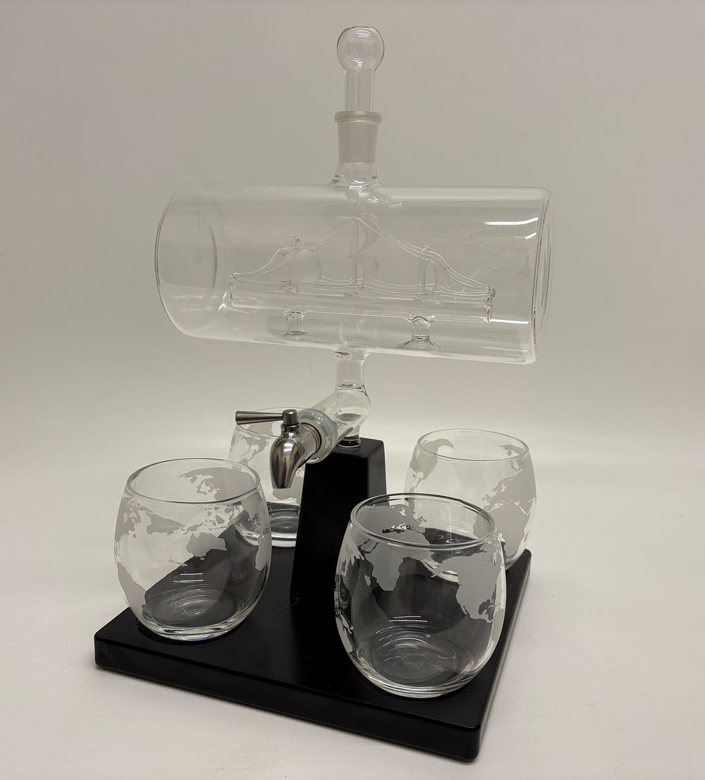 Lot 152: A Glass Spirits Decanter Set with Internal Sailing Ship and Globe Etched Tumblers