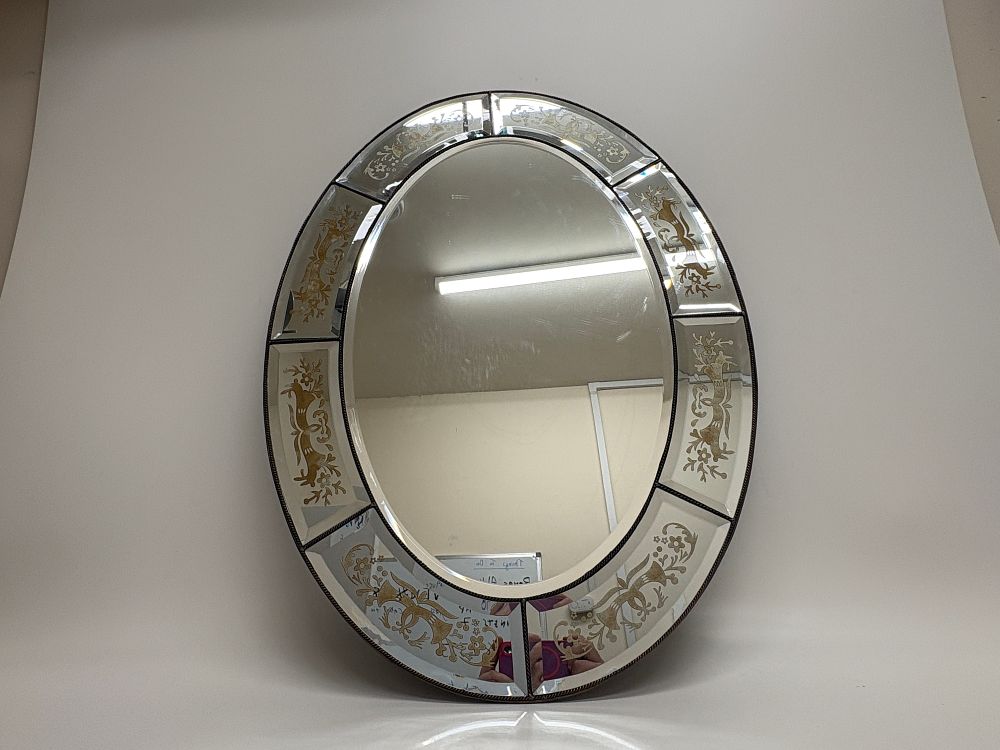 Lot 162: A large oval Venetian style wall mirror with decorative etched glass border