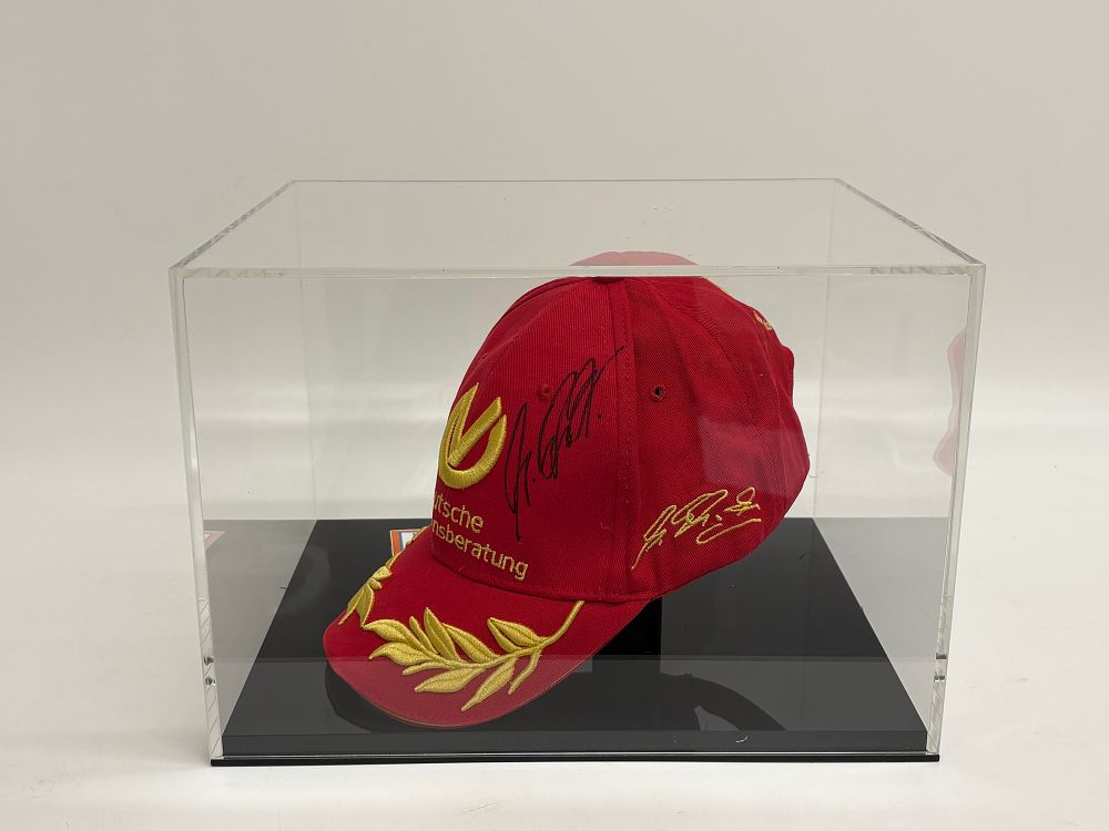 Lot 242: Michael Schumacher Signed Ferrari Formula 1 Souvenir Cap with Certificate of Authenticity