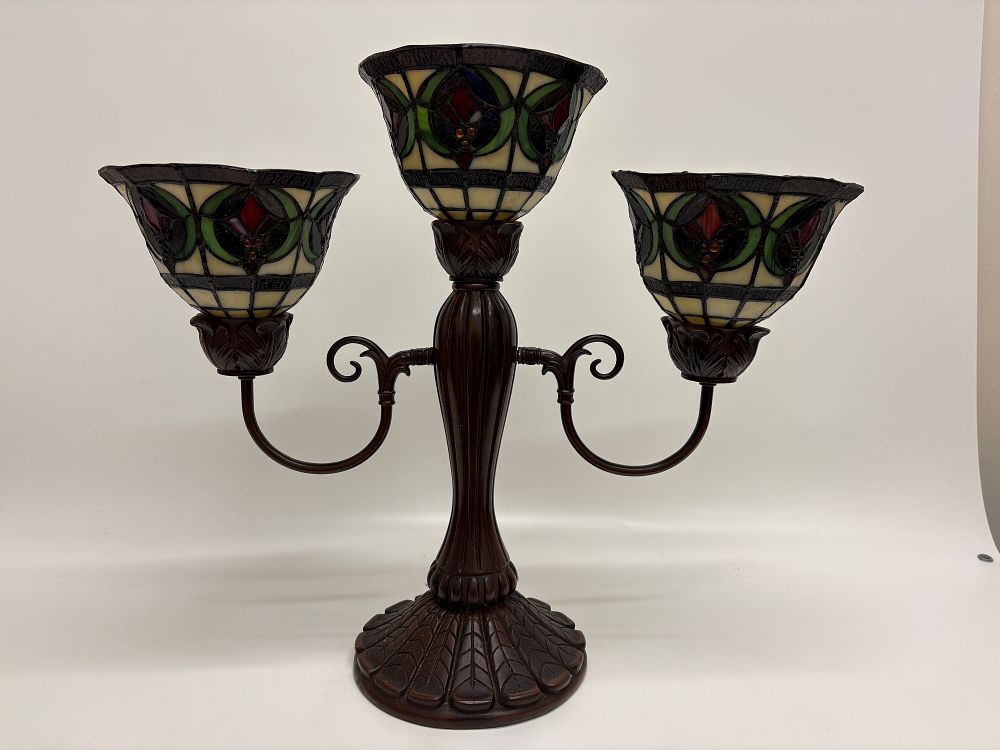 Lot 354: A Trio of Stained Glass Tiffany Style Candle Shades on a Three Light Candelabrum Base