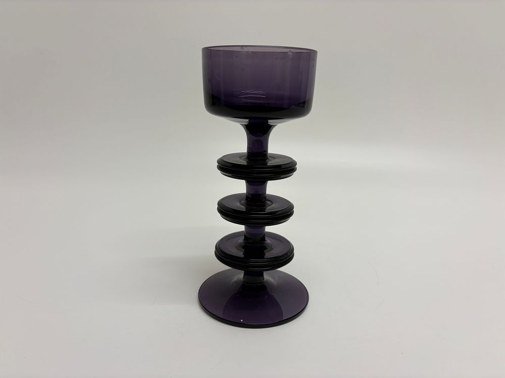Lot 381: An amethyst glass three-ring Sheringham candlestick