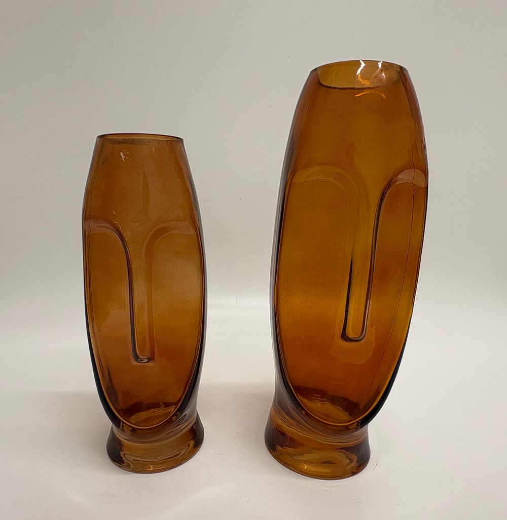 Lot 388: A pair of amber glass visage vases